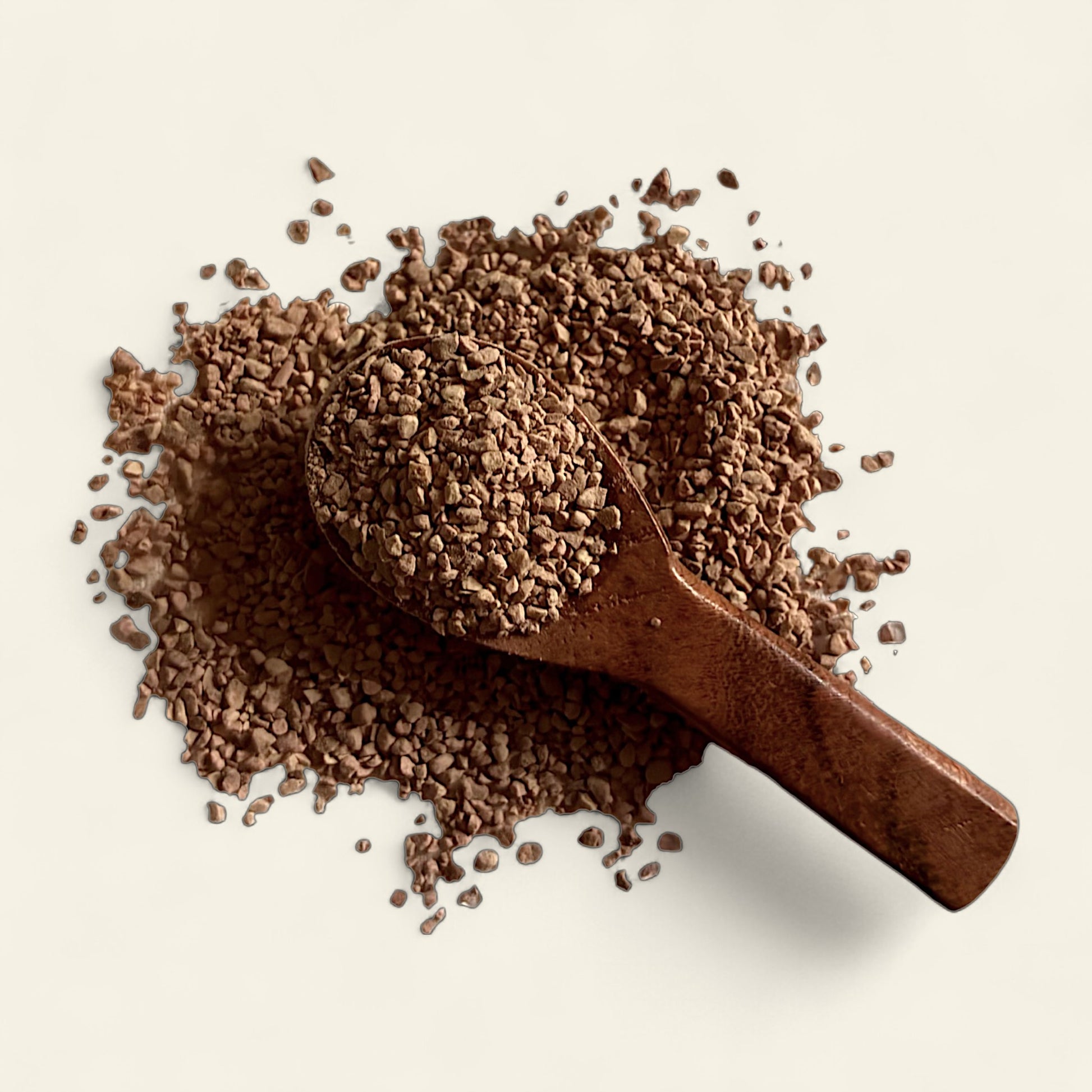 All's Well Teas and Elixirs Cinnamon Twilight - Our soothing, warming evening blend to gently melt away tension and restore vitality.

Wooden scoop filled with a granulated tea blend on a light beige background