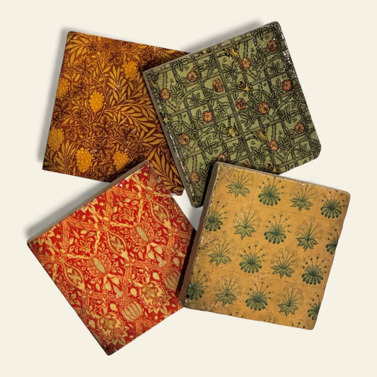 Multicolored stone coasters arranged on a beige background