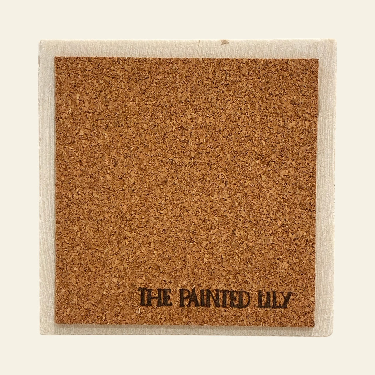 Cork back of a stone coaster on a beige background