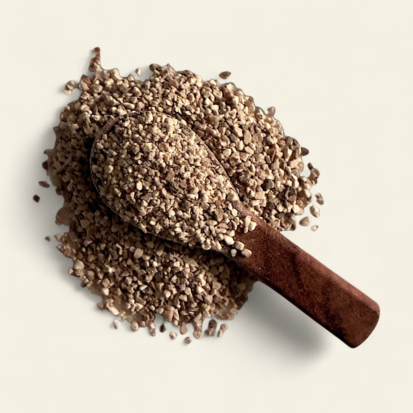 All's Well Teas and Elixirs Two Too Many - Our detoxifying, restorative blend to ease digestion and soothe discomfort after overindulgence or imbalance.

Wooden scoop filled with herbal tea granules on a light beige background